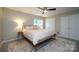 Cozy bedroom with neutral walls, large window, and closet with double doors at 2908 Barnard Castle Ln, Matthews, NC 28104
