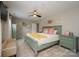 Spacious bedroom featuring bright windows, an accent chair and a charming color scheme at 2908 Barnard Castle Ln, Matthews, NC 28104