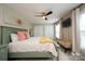 A bedroom with a window view, complemented by elegant drapes and a comfortable bench at 2908 Barnard Castle Ln, Matthews, NC 28104