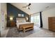 Main bedroom boasts a vaulted ceiling, panel accent wall, and natural light at 2908 Barnard Castle Ln, Matthews, NC 28104