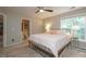 Bedroom featuring a window, ceiling fan and ensuite bathroom at 2908 Barnard Castle Ln, Matthews, NC 28104