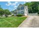 Suburban two-story home with a well-maintained lawn and a driveway leading to an attached garage at 2908 Barnard Castle Ln, Matthews, NC 28104