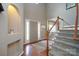 Inviting foyer featuring hardwood floors, staircase, and ample natural light from sidelight windows at 2908 Barnard Castle Ln, Matthews, NC 28104