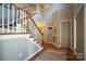 Grand foyer with a staircase and hardwood floors leading to the upper level of the home at 2908 Barnard Castle Ln, Matthews, NC 28104