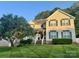 Charming two-story home with a well-manicured lawn and inviting front porch perfect for relaxing at 2908 Barnard Castle Ln, Matthews, NC 28104
