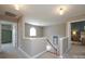 Hallway with a view into a bedroom and stairs leading down at 2908 Barnard Castle Ln, Matthews, NC 28104