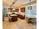 Well-lit kitchen featuring stainless steel appliances, dark wood cabinetry, and a cozy breakfast nook at 2908 Barnard Castle Ln, Matthews, NC 28104