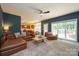 Open concept living room seamlessly connects with the kitchen and dining area, featuring ample natural light at 2908 Barnard Castle Ln, Matthews, NC 28104