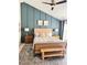 Stylish main bedroom featuring a vaulted ceiling, accent wall, plush rug, and comfortable furniture at 2908 Barnard Castle Ln, Matthews, NC 28104