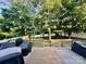 Spacious wooden deck perfect for outdoor entertaining, featuring string lights and ample seating at 2908 Barnard Castle Ln, Matthews, NC 28104