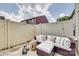 Cozy backyard featuring patio furniture, decorative lanterns, and a privacy fence at 318 Willow Wood Ct, Matthews, NC 28104