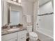 Bright bathroom featuring vanity with granite countertop, toilet, and shower with tub at 318 Willow Wood Ct, Matthews, NC 28104