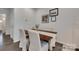 Dining area view with modern table, upholstered chairs, and neutral wall decor at 318 Willow Wood Ct, Matthews, NC 28104