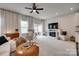 Bright living room features plush carpet, a fireplace, and sliding glass doors to an outdoor space at 318 Willow Wood Ct, Matthews, NC 28104