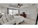 Bright main bedroom featuring neutral tones, plush carpet, and ample natural light from windows at 318 Willow Wood Ct, Matthews, NC 28104