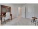 Neutral office space featuring plush carpet, a desk with chair, and ample natural light at 318 Willow Wood Ct, Matthews, NC 28104