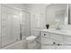 This bathroom includes a glass enclosed shower, tile flooring, and a white vanity at 32612-B Millingport Rd # 7157, New London, NC 28127