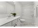 Bright bathroom featuring a shower over tub and a white vanity with stone countertops at 32612-B Millingport Rd # 7157, New London, NC 28127