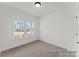 This bedroom includes carpet, and two windows providing lots of natural light at 32612-B Millingport Rd # 7157, New London, NC 28127