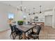 Bright dining area features a wooden table, modern lighting, and an open-concept layout at 32612-B Millingport Rd # 7157, New London, NC 28127