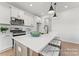 Modern kitchen features stainless steel appliances, white cabinets, a center island, and recessed lighting at 32612-B Millingport Rd # 7157, New London, NC 28127
