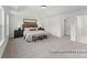 The main bedroom includes bright natural light, carpet, and a doorway to the main bathroom at 32612-B Millingport Rd # 7157, New London, NC 28127