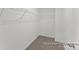 A walk-in closet provides ample storage space with built in metal shelving at 32612-B Millingport Rd # 7157, New London, NC 28127