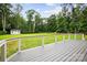 This backyard deck provides outdoor living space and overlooks a big yard at 3324 Greenhurst Dr, Matthews, NC 28104