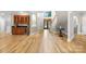 Inviting foyer featuring a wet bar, hardwood floors, and staircase at 3324 Greenhurst Dr, Matthews, NC 28104