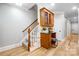 Hallway featuring a desk, cabinet, stairwell and access to the rest of the home with hardwood floors at 3324 Greenhurst Dr, Matthews, NC 28104