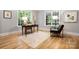 Bright office space featuring natural light, hardwood floors, neutral walls, and classic furnishings at 3324 Greenhurst Dr, Matthews, NC 28104