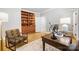 Comfortable office space with built-in shelving, a patterned chair, and a wooden desk perfect for working from home at 3324 Greenhurst Dr, Matthews, NC 28104