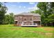 A lovely brick home provides an expansive backyard and screened in porch at 3324 Greenhurst Dr, Matthews, NC 28104