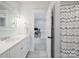 Bright white bathroom with a marble vanity, modern fixtures, and a view into an office space at 431 Wonderwood Dr, Charlotte, NC 28211