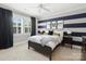 Charming bedroom with an aviation theme, striped walls, and a comfortable bed at 431 Wonderwood Dr, Charlotte, NC 28211