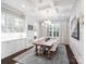 Formal dining room featuring coffered ceilings, a large window, and a modern chandelier at 431 Wonderwood Dr, Charlotte, NC 28211