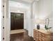 Stately foyer showcasing hardwood floors, decorative light fixture, and traditional wainscoting at 431 Wonderwood Dr, Charlotte, NC 28211