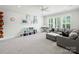 Spacious living room with lots of natural light and decorative shelving, plus comfortable seating at 431 Wonderwood Dr, Charlotte, NC 28211