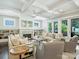 Bright living room with a fireplace, built-in shelving, and access to the outdoor patio at 431 Wonderwood Dr, Charlotte, NC 28211