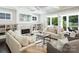 Comfortable living room with a fireplace, built-in shelves, and lots of natural light at 431 Wonderwood Dr, Charlotte, NC 28211