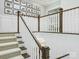 Elegant staircase with white railing, dark wood accents, and runner that enhances the home's architectural details at 431 Wonderwood Dr, Charlotte, NC 28211