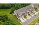 Aerial view of townhomes with lush lawns, neat landscaping, and ample parking for residents at 44409 Oriole Dr # 200, Indian Land, SC 29707