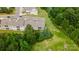 Aerial view of townhomes nestled amidst lush greenery and manicured lawns, offering serene living at 44409 Oriole Dr # 200, Indian Land, SC 29707
