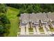 Aerial view showcases townhomes with well-maintained lawns, driveways, and convenient parking at 44409 Oriole Dr # 200, Indian Land, SC 29707