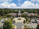 Aerial shot of the community center, displaying lush landscaping, circular driveway, and parking at 44409 Oriole Dr # 200, Indian Land, SC 29707