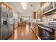 Spacious kitchen with stainless steel appliances, wooden cabinetry, granite countertops, and hardwood floors at 44409 Oriole Dr # 200, Indian Land, SC 29707