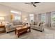 Inviting living room featuring comfortable seating, neutral decor, and a view of the adjacent kitchen area at 44409 Oriole Dr # 200, Indian Land, SC 29707
