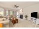 Bright living room with neutral tones, a fireplace, comfortable seating, and a ceiling fan at 44409 Oriole Dr # 200, Indian Land, SC 29707