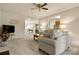 Spacious living room with open floor plan, neutral colors, and views of the dining area and kitchen at 44409 Oriole Dr # 200, Indian Land, SC 29707