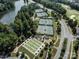 Overhead shot of the tennis and bocce ball courts in a community setting near a pond at 44409 Oriole Dr # 200, Indian Land, SC 29707